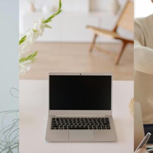 A laptop on a wooden table with a soft, cozy background.